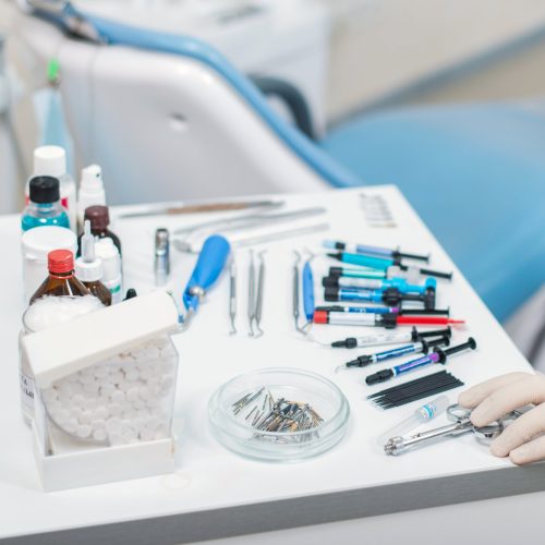 Dentist selecting his items. Dentist equipment. Stomatologist tools